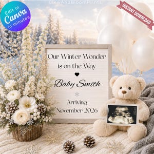 Peut inclure: Un panneau rectangulaire avec le texte Our Winter Wonder is on the Way Baby Smith Arriving November 2026, accompagné d'un ours en peluche beige tenant une échographie, un panier de fleurs blanches, des pommes de pin et des ballons blancs.