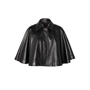 May include: A black leather cape with a collar and button closure. The cape has a classic design and a smooth texture. The garment is displayed against a white background.