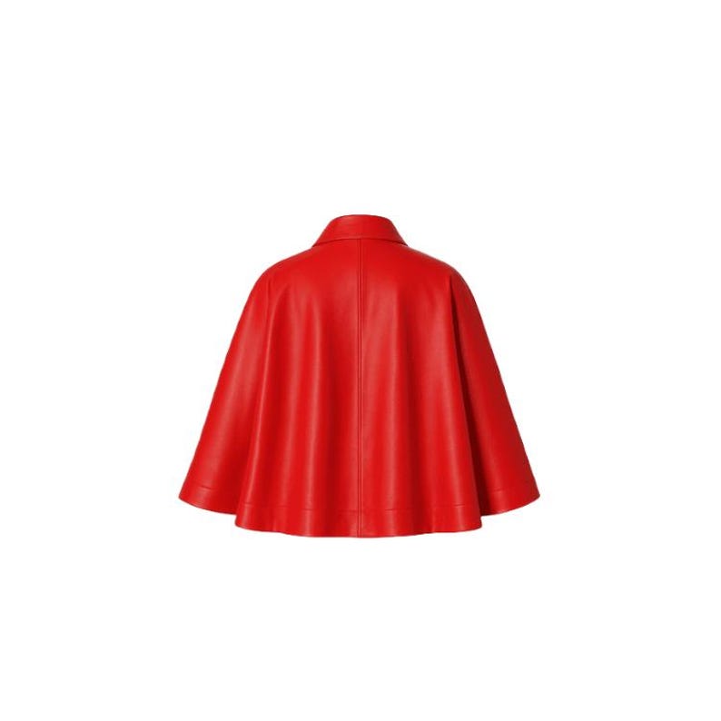 May include: A vibrant red cape with a classic collar and a flowing silhouette. The cape is made of a smooth, possibly leather-like material, and is designed to be worn over the shoulders. The back view is shown against a white background.