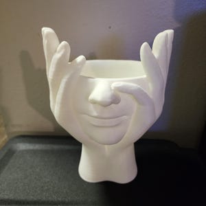 Hands on face