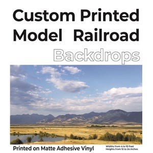 May include: Custom printed model railroad backdrops. The image shows a scenic landscape with a blue sky, clouds, mountains, and a body of water. The backdrops are printed on matte adhesive vinyl. Available in widths from 4 to 10 feet and heights from 12 to 24 inches.