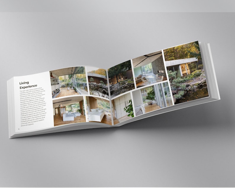 Pu&ograve; includere: Un libro aperto con il titolo "Living Experience" e diverse foto di interior design. Le immagini mostrano case moderne con ampie finestre, luce naturale e vista sull'esterno. Il libro &egrave; aperto su una superficie grigia.