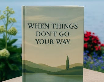 May include: A hardback book titled "WHEN THINGS DON'T GO YOUR WAY" with a landscape illustration. The cover shows rolling green hills, a lake, and a single tree. The book is a reflective journal and workbook for adults.