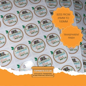 May include: A sheet of round stickers featuring the "Tanger Read Book Club" logo. The stickers have a transparent finish and are available in sizes from 25mm to 100mm. The logo includes a stack of books and the text "Tanger Read Book Club."