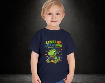Camiseta infantil "Level Up Little Dino" / Gráfico de dinosaurio gamer