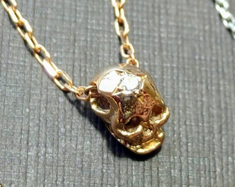 Gold skull necklace, gold skull and diamond. Funky skull necklace. Cool skull necklace. Diamond necklace. Skull necklace. Diamond skull