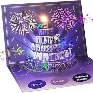May include: A pop-up birthday card with a three-tiered cake, the words "HAPPY BIRTHDAY" lit up in white. The card has a purple background with fireworks and musical notes. Buttons read "LIGHTS UP", "PLAY MUSIC", and "Multicoloured Fireworks".