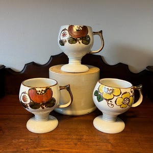 Set of 3 Otagiri Vintage Speckled Stoneware Footed Hand-Painted Pedestal Mugs with Floral Design