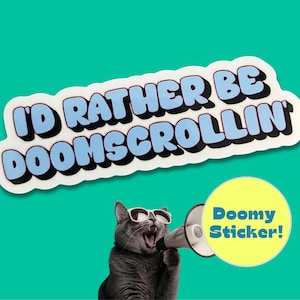 May include: A sticker with the text "I'D RATHER BE DOOMSCROLLIN" in a blue and white bubble font. A gray cat wearing sunglasses and holding a megaphone is below the text. A yellow circle with the words "Doomy Sticker!" is also in the image.