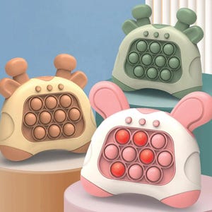 May include: Three colorful sensory toys in the shape of animals. The toys have a push-pop bubble design with a variety of colors, including pink, green, and yellow. Each toy has a different animal shape, including a giraffe and a bunny.