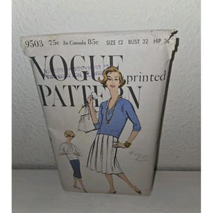 May include: Vintage Vogue Pattern envelope featuring a fashion illustration of a woman in a blue top and white skirt. The envelope is labeled "VOGUE PATTERN" with size and measurement details. The illustration is in a retro style.