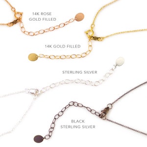 May include: Four necklace chains with different clasps and jump rings. The chains are 14k rose gold filled, 14k gold filled, sterling silver, and black sterling silver.