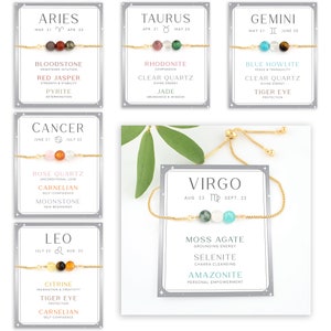 May include: A set of 10 zodiac-themed bracelets with gold chains and different colored gemstones. Each bracelet features a zodiac symbol and the corresponding birth dates. The gemstones are labeled with their names and associated meanings.