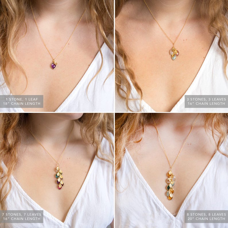 May include: Four gold necklaces with different lengths and numbers of stones and leaves. The necklaces are shown on four different models wearing white shirts. The necklaces are 18 inches, 16 inches, 16 inches, and 20 inches long. The necklaces have 1, 3, 7, and 8 stones, respectively. The necklaces also have 1, 3, 7, and 8 leaves, respectively.
