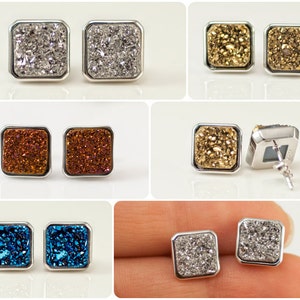 May include: A set of silver earrings with square-shaped agate stones. The stones are in various colors, including silver, gold, brown, and blue.