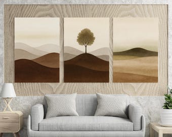 May include: A triptych of landscape art prints. Each print features a minimalist design with rolling hills in shades of brown, beige, and green. The central print showcases a tree atop a hill. The artwork is framed and ready to hang.