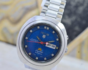 Reloj automático vintage Ricoh Crystal para hombre, 21 joyas, día y fecha, esfera azul, fabricado en Japón.