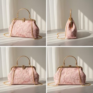 May include: A light pink handbag with a gold-colored handle and chain strap. The bag features an embroidered floral design. The clasp and handle are gold-toned. The bag is shown from multiple angles.