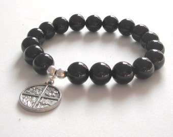 Pulsera de chakras con piedras preciosas de ónix, dije de los cuatro elementos y cuentas de plata de ley.