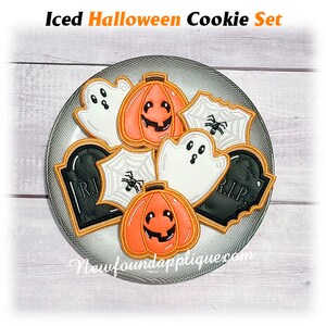 May include: A set of iced Halloween cookies arranged on a plate. The cookies include pumpkin, ghost, spiderweb, and tombstone shapes, with orange, black, and white icing. The text "Iced Halloween Cookie Set" is at the top.