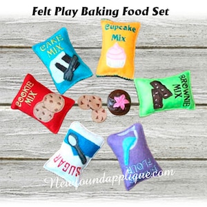 May include: Felt play food set for pretend baking. Includes bags of cake mix, brownie mix, cookie mix, cupcake mix, sugar, and flour. Also includes felt cookies and a cupcake.