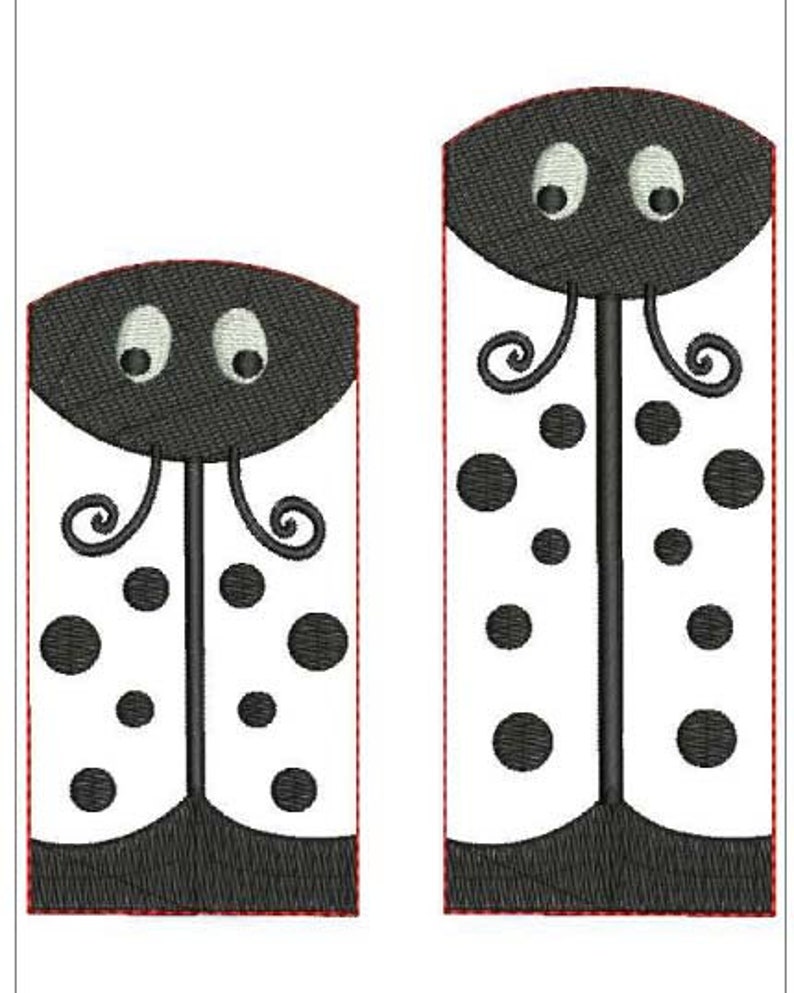 May include: Two embroidered ladybug designs. Each ladybug has a black head with white eyes, a white body with black spots, and a black base. The designs are outlined in red.