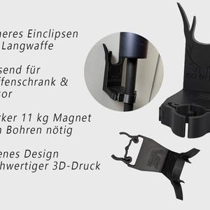 Könnte beinhalten: Schwarzer 3D-gedruckter Waffenhalter mit Hirschgeweih-Design. Der Halter ist so konzipiert, dass er sicher an einer Langwaffe befestigt werden kann und für einen Waffenschrank oder Tresor geeignet ist. Er verfügt über einen starken 11 kg Magneten und erfordert kein Bohren.