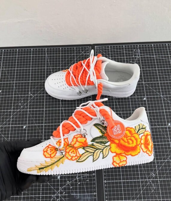 yellow nike with rose