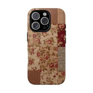 May include: A phone case with a patchwork design featuring floral patterns in shades of beige, brown, and red. The case has a camera module with three lenses and a flash.