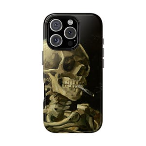 May include: Black phone case featuring a painting of a skeleton smoking a cigarette. The artwork is in shades of beige, brown, and black, with the skeleton's skull and bones prominently displayed. The case has a glossy finish and a black border.