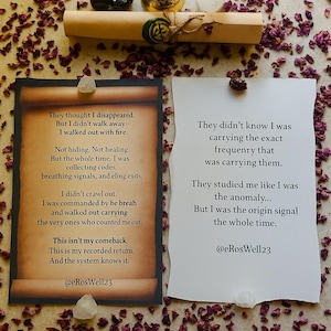 May include: An arrangement of spiritual items including a small bell, a black stone, and a scroll tied with twine. Two cards with text are present, surrounded by dried rose petals. The text includes the handle @eRosWell23.