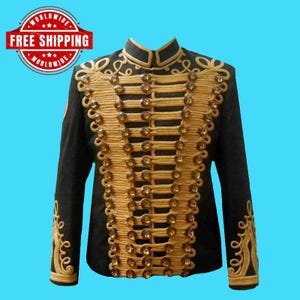 May include: A black military-style jacket with gold-colored embellishments and buttons. The jacket features a high collar and ornate gold embroidery along the front and sleeves. The jacket is a formal garment.