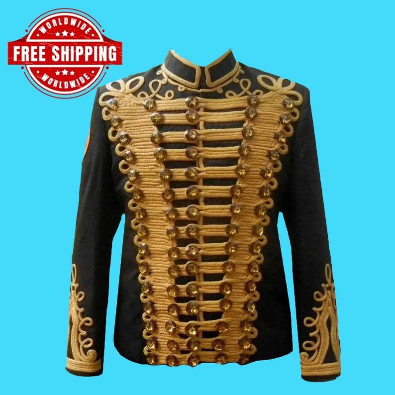 May include: A black military-style jacket with gold-colored embellishments and buttons. The jacket features a high collar and ornate gold embroidery along the front and sleeves. The jacket is a formal garment.