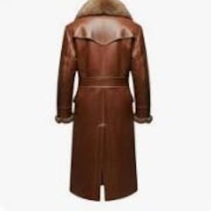 May include: A long, brown leather coat with a fur collar. The coat features a belt at the waist and fur trim on the cuffs. The coat is approximately 55 inches long.