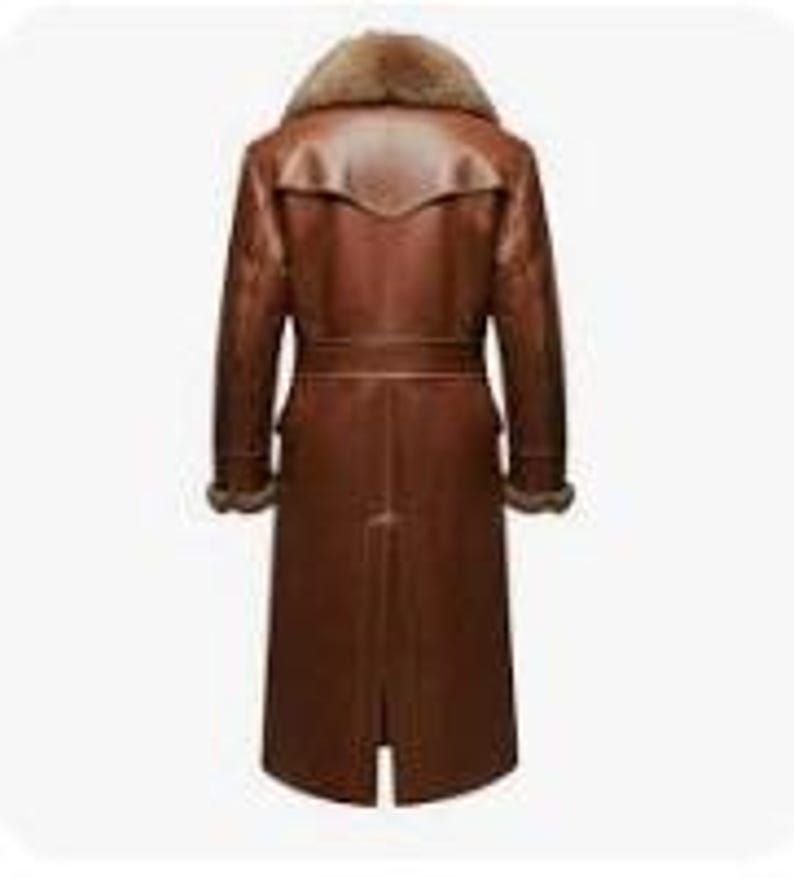 May include: A long, brown leather coat with a fur collar. The coat features a belt at the waist and fur trim on the cuffs. The coat is approximately 55 inches long.