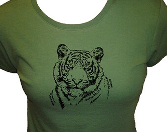 May include: A green t-shirt with a black and white illustration of a tiger's face.