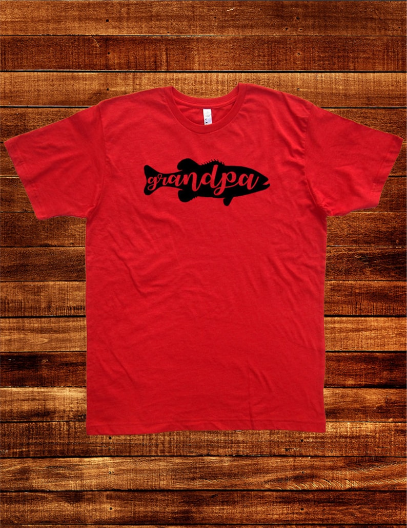 May include: Red t-shirt with a black silhouette of a fish with the word "grandpa" written inside the fish.