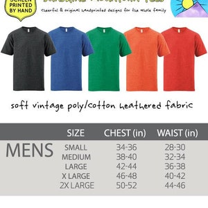 May include: Size chart for men's t-shirts with different chest and waist measurements in inches. The chart shows sizes from small to 2X large.  The text "Designed and Screen Printed by Hand" and "Sunshine Mountain Tees" is at the top of the image.