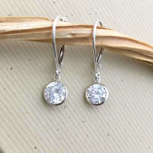 Sterling Silver Rhodium-plated 6mm Round CZ with Swirl Earrings Jackets Sterling Silver Rhodium-plated 6mm Round CZ with Swirl Earrings Jackets