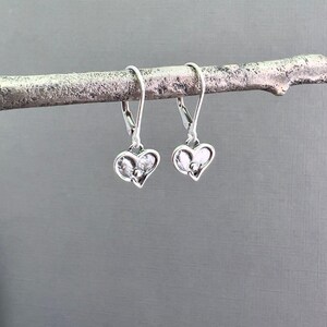 Dainty Silver Earrings Tiny Heart Charm Oxidized Finish Dimensional Texture Everyday Accessory Perfect Daily Wear Minimalist Jewelry Design Feminine Style Elegant Simple Look Leverback Option Available Handcrafted Artisan Quality Sterling