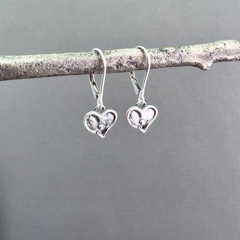 Dainty Silver Earrings Tiny Heart Charm Oxidized Finish Dimensional Texture Everyday Accessory Perfect Daily Wear Minimalist Jewelry Design Feminine Style Elegant Simple Look Leverback Option Available Handcrafted Artisan Quality Sterling