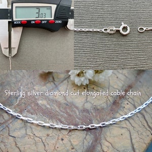 May include: A close-up of a silver diamond cut elongated cable chain. The chain is 3.03 mm wide. Sterling silver diamond cut elongated cable chain.