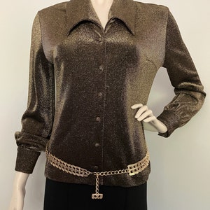The "All That Glitters is Gold" 1960s lurex button up long sleeve blouse by 'Crestknit'. Rare size 16.