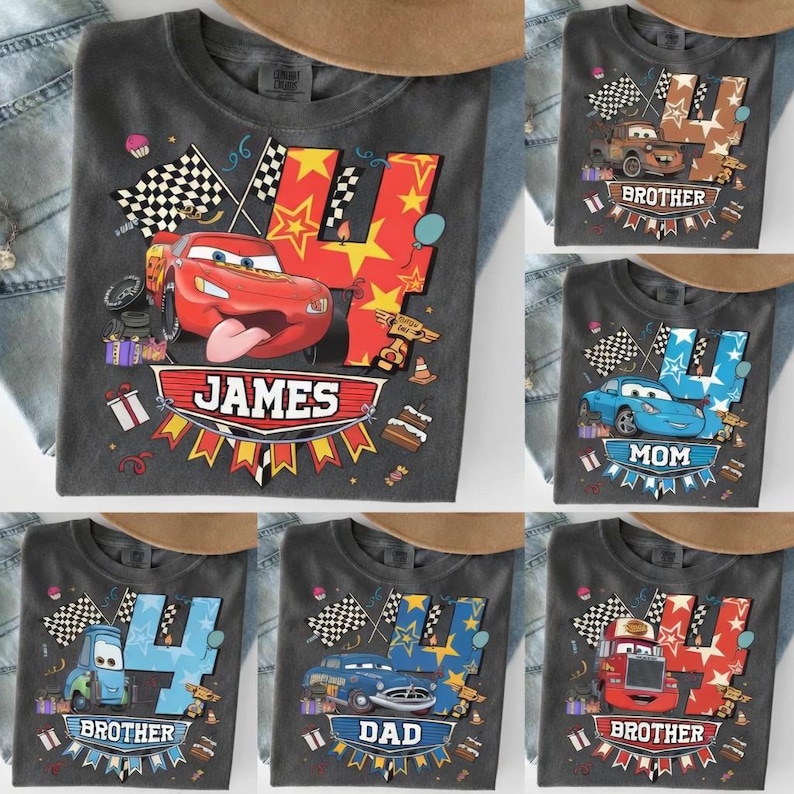 May include: A collection of gray t-shirts featuring the number 4 with a car theme. Designs include Lightning McQueen, Mater, and other characters. Some shirts have names like "James", "Mom", and "Dad".