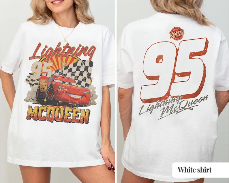 May include: White t-shirt featuring a distressed graphic of Lightning McQueen, the number 95, and the text "Lightning McQueen." The front design includes a checkered flag and a sunburst. The back of the shirt displays a large "95" and the text "Lightning McQueen."