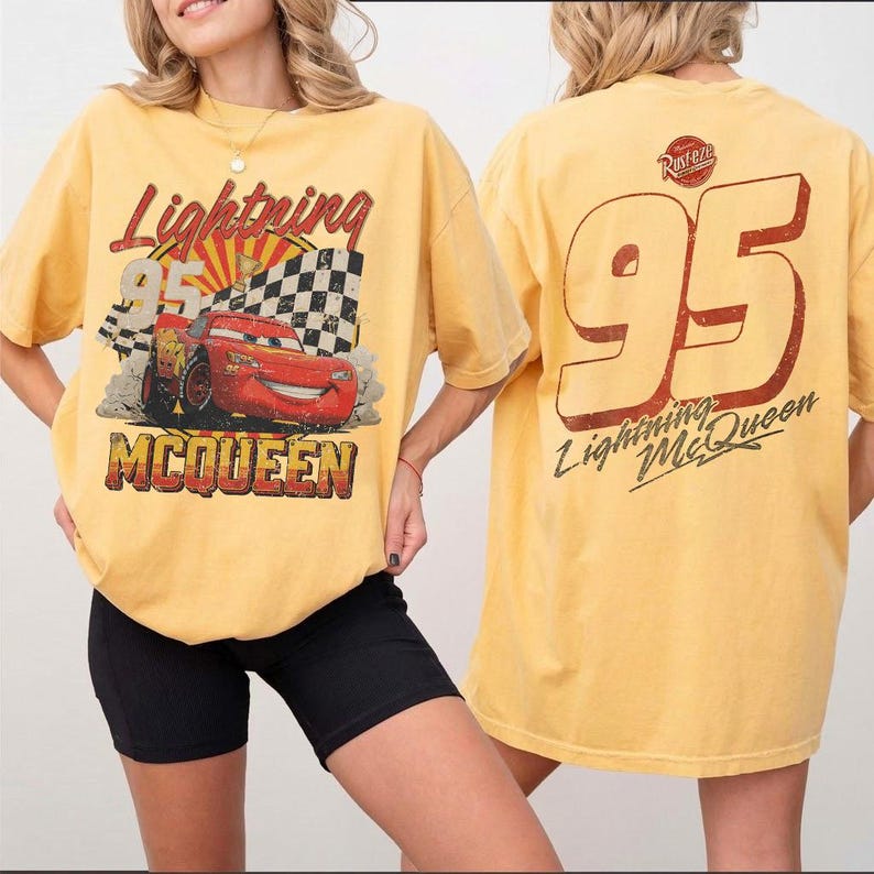 May include: Yellow Lightning McQueen t-shirt with a distressed graphic of the character and the number 95. The front design includes the text "Lightning McQueen" and "McQueen". The back features a large "95" and "Lightning McQueen" text.