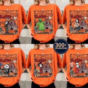 Op de afbeelding: Oranje T-shirts met korte mouwen met verschillende personages uit "The Nightmare Before Christmas" en de tekst "Disney Oogie Boogie Bash". Elk shirt heeft een ander karakterontwerp, waaronder Jack Skellington en Sally.