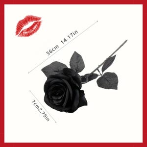 May include: A black rose with a stem and leaves, measuring 14.17 inches (36 cm) long and 2.75 inches (7 cm) wide. A red lip print is in the upper left corner. The rose is a decorative item.