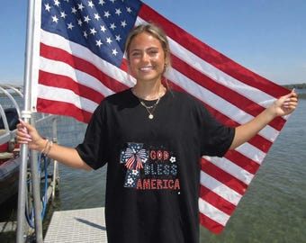 Camiseta "Orgulloso estadounidense", Cruz "Dios bendiga a América", Cuatro de Julio