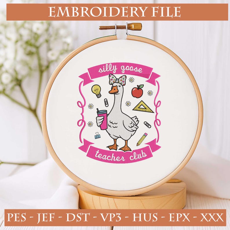 May include: An embroidery hoop with a white fabric featuring a cartoon goose design. The goose wears a bow and holds a drink. The text "silly goose teacher club" is displayed on a pink banner. The words "EMBROIDERY FILE" are at the top.